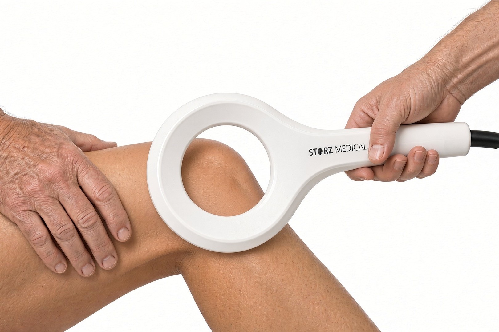 Storz Medical Magnetolith EMTT loop applicator positioned at the knee